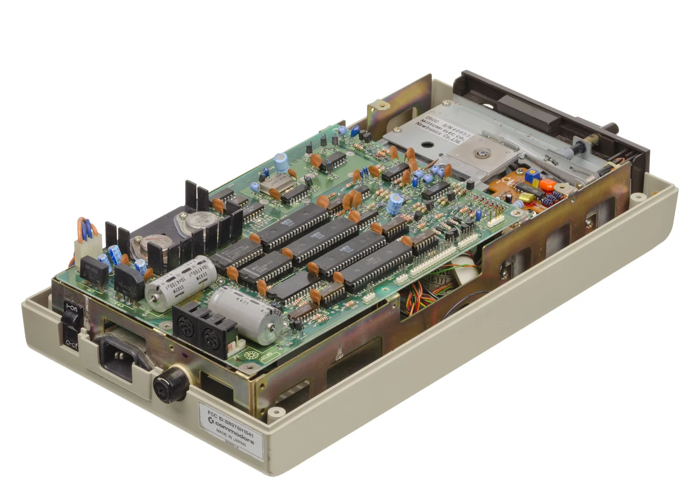 Open Commodore 1541 floppy drive showing the internal mechanism